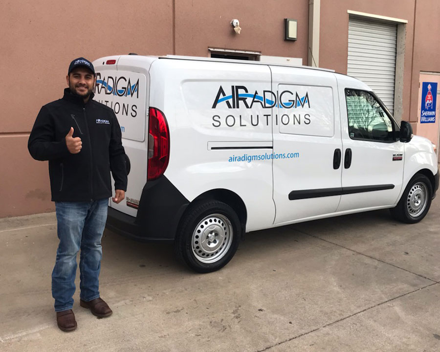 Photo of our Airadigm team in front of our New Hampshire office